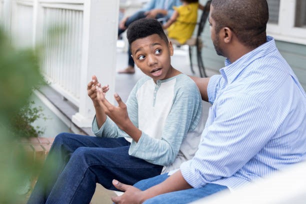 Stressed child talking to dad